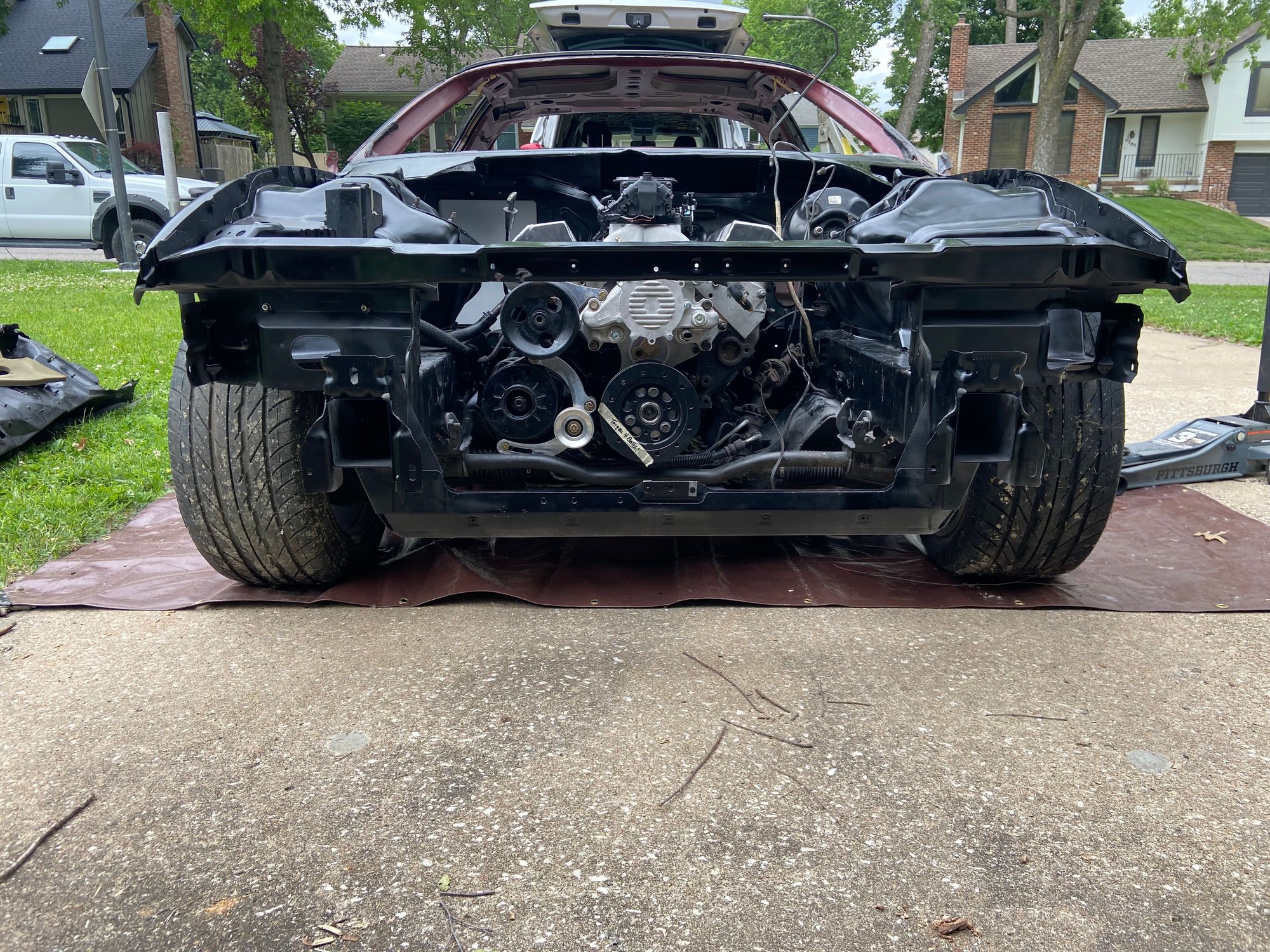 Installed the engine back into the car. Looks good with the black painted engine bay.