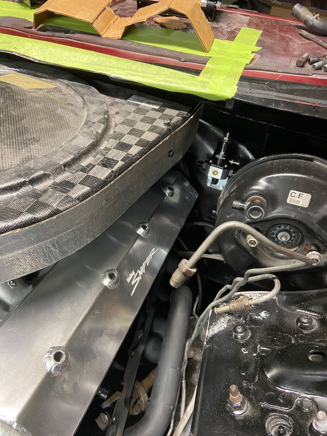 Mounted the Aeromotive fuel regulator in a spot that would be accessible for when needed. Was a good spot because the LS style Holley kit has an electrical connection for fuel pressure right at this location.