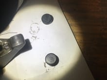 both caps did have the paint fully rubbed off on rocker and rod side.  also a few perfect circles are visible in the steel.  could be from casting idk.  but why would the entire cap have the paint missing?  i had a new one leftover to compare it to.  no circles on the new one