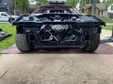 Installed the engine back into the car. Looks good with the black painted engine bay.
