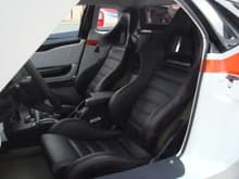 Carbonfiber Seats wrapped with black Leather  with orange trim