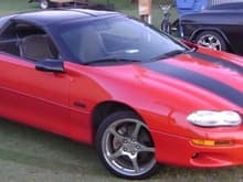 99 camero LS1, I have powder coated the rims black,and painted calipers red.Done a few mods to engine and will continue till I'm happy with it.
