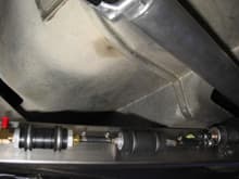 Installation of prefilter, Walsbro GSL 392 fuel pump, and Corvette filter/regulator along the rear X-member, driver's side.