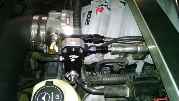 fuel pressure regulator mounted on schrader valve port of fuel rail