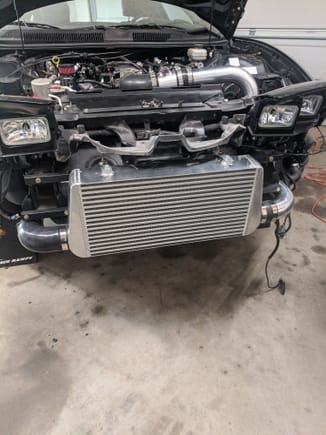 Intercooler fully mounted.   I do need to replace some support brackets I butchered.  