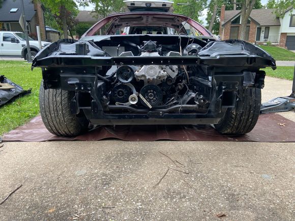 Installed the engine back into the car. Looks good with the black painted engine bay.