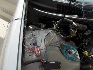 PCM removed and wires being run through the firewall to the switch plate.
