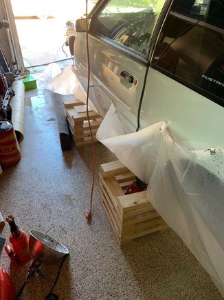 You can see how I wrapped the plastic sheeting up the side of the car and held the plastic there with super strong, rare earth magnets.