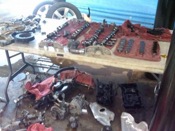 After the customer traded in the 04 Max for a 09 Murano, I bought it for $2850 and got to work. Heres a pic of the engine torn apart.
