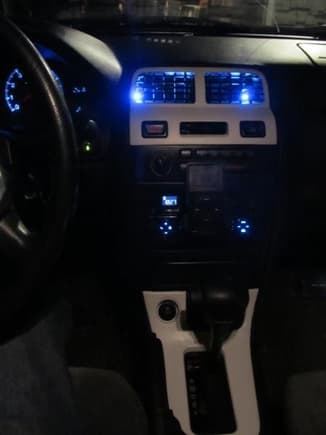 Still working on it, but going to do the rest (or as much of it as I can) of the center console white along with the rest of the vents, gauge trimming, door handle trimming, and the Window/lock control trimming.. and then when I have the time and money the exterior. Also going to add more blue LEDs at some point