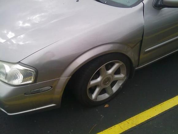 Slammed into a curb. F***ed up the entire suspension and driver side fender. 3 new tires, 2 new rims and $3200 later it's as good as new.