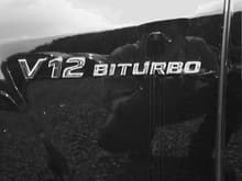 V12 BITURBO badge