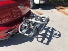 The support bar that has the two bike stabilizers is down in this picture. You can see how the rack screws into the chassis. 