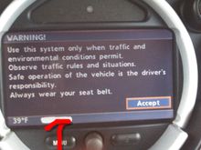 Crazy things I have a 2005 Mini Cooper hatchback. It's supposed to have GPS and the screens come up but it never synchronizes. Perhaps bad antenna if so where is it located I'm also assuming that on the initial screen there seems to be an odd portion of the screen which looks like somebody took a gray marker and drew a 3/4 in horizontal line across the bottom would that be where a clock might  appear, assuming an accurate GPS signal is received I've marked the area in red in the attached photo..