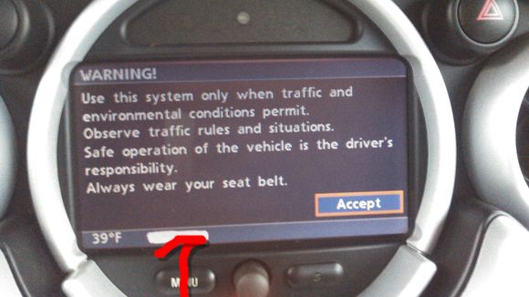 Crazy things I have a 2005 Mini Cooper hatchback. It's supposed to have GPS and the screens come up but it never synchronizes. Perhaps bad antenna if so where is it located I'm also assuming that on the initial screen there seems to be an odd portion of the screen which looks like somebody took a gray marker and drew a 3/4 in horizontal line across the bottom would that be where a clock might  appear, assuming an accurate GPS signal is received I've marked the area in red in the attached photo..