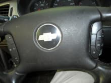 the leather type steering wheel. new to me from a salvage car. the steering wheel is like new with radio controls.