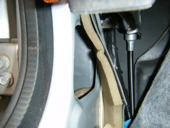 Access hole below emergency brake