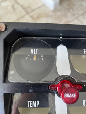 The gauge tipping from a melted mount. 