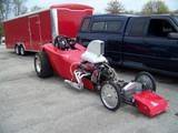 This is how I got it. Minus the motor and transmission.  Found the scoop on ebay.  I didn't like the aluminum front.  Neither did the trailer.  It got...removed, by accident.