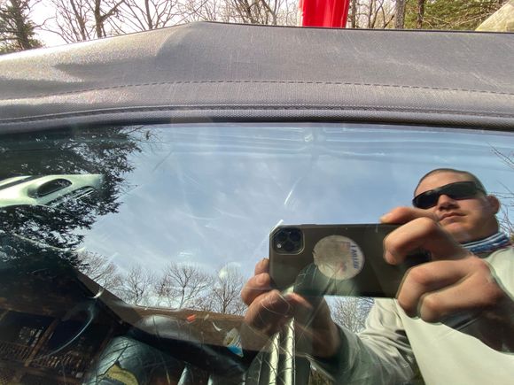 Photo of it sagging from outside car. It’s at the lip of the convertible top, if it rained it would go in due to the inside convertible frame sagging