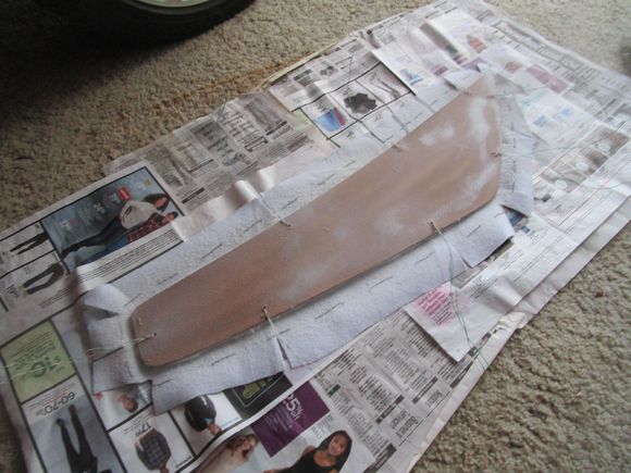 Vinyl and Masonite sprayed with glue