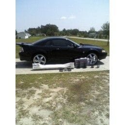 MY 99 MUSTANG WITH 20INCH STAGGERED RIMS,
