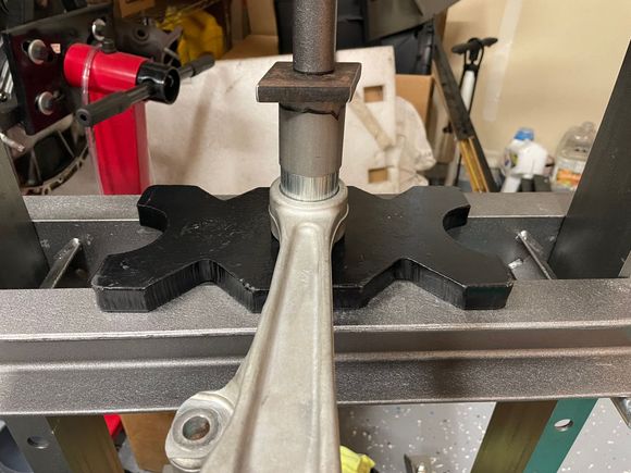 Pressing in the Whiteline bushings with homemade pipe die.