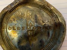 My 11 year old loves metal detecting.  He found this Oldsmobile part in the forest near our home. I was hoping someone could identify the part and what car it may have come from. It’s about the circumference of a baseball... possibly a center cap.