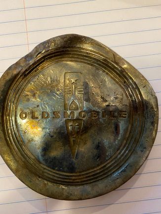 My 11 year old loves metal detecting.  He found this Oldsmobile part in the forest near our home. I was hoping someone could identify the part and what car it may have come from. It’s about the circumference of a baseball... possibly a center cap.