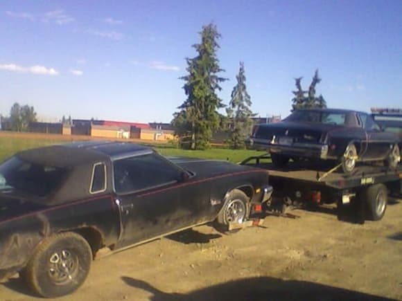My 76 and 77 Cutlass going to my new garage. The 77 on the flatbed, and the 76 to-be-engine-donor on the back.