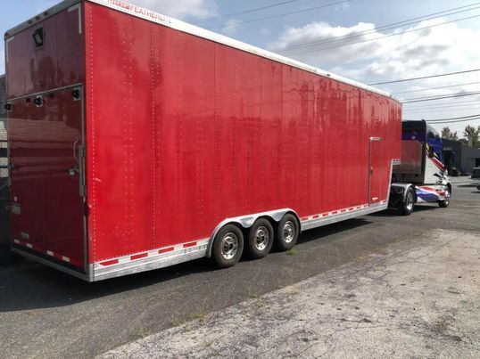 2000 Kenworth T2000 and 2002 Featherlite Aluminum Stacker Tr for Sale $95,000