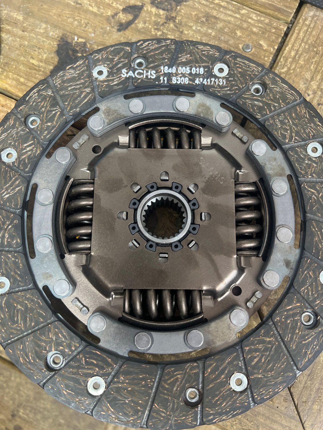 Here is a picture of the back of the clutch with the circular rivets. This is a new clutch I bought for my s2 from the same vendor. 