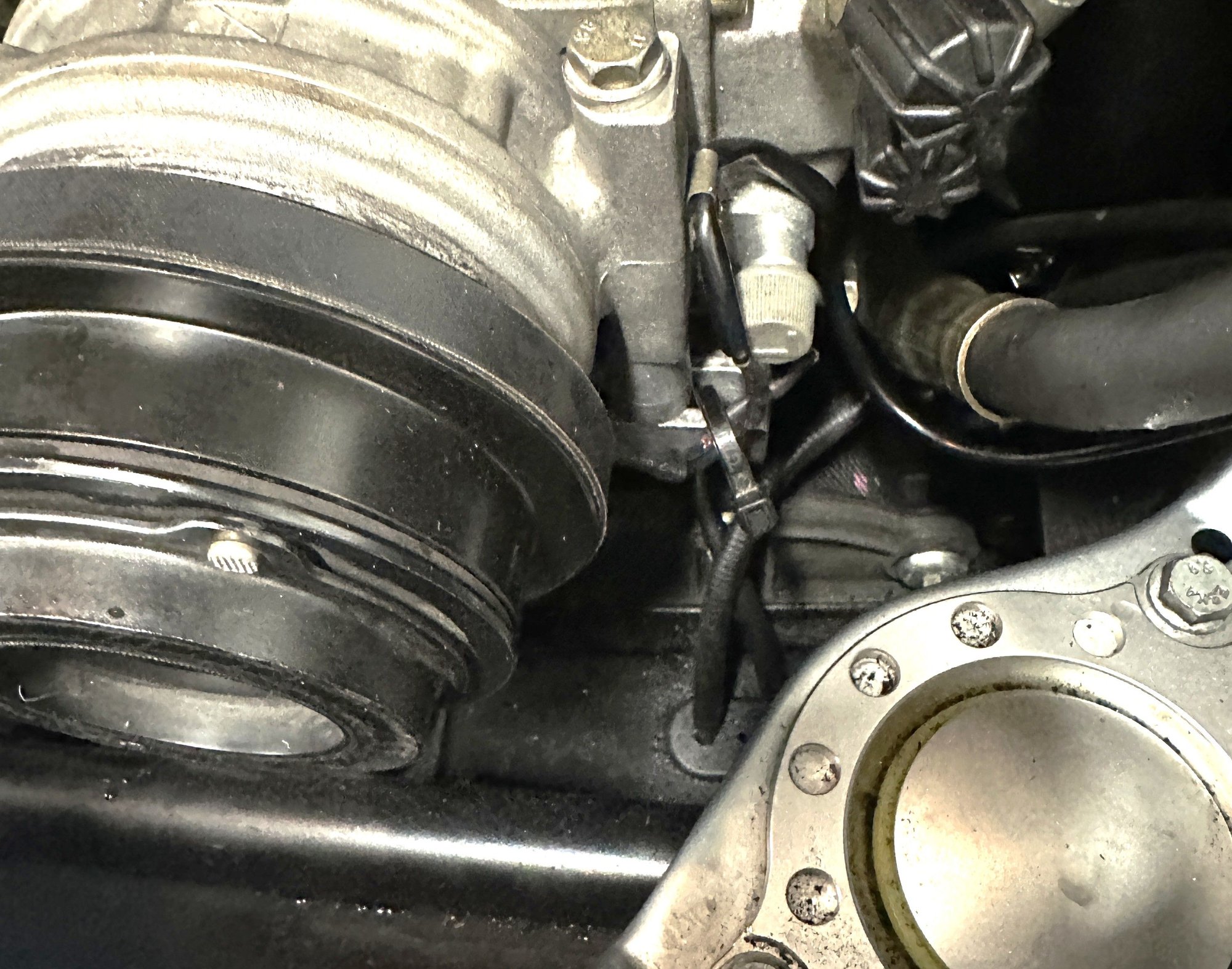Completed installation, after soldering and heat shrinking, I zip tied the slack to the bottom of the compressor mount hole/slot to keep it out of the way of rotating parts.