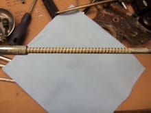 White lithium grease applied to spiral wrapped cable.