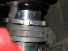 Bilstein HDs with ROW Turbo (red) springs. About 20 mm of gap between the spring mount and spring. The classic "floating spring" issue.