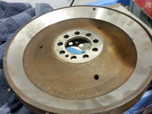 Machined block side of flywheel with about 6 pounds of material removed.