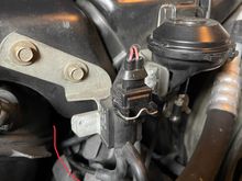 Vacuum hose connected and routed over distributor. 