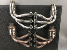 OEM stock versus Fabspeed race competition headers with 321SS. Notice investment cast flanges