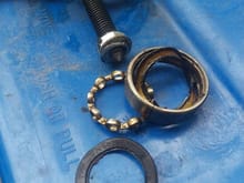 Destroyed outer bearing and end of puller with deformed washer and nut.