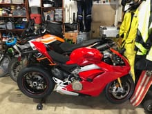 New Ducati Panigale V4s.  Behind it is my KTM 1290 Adventure R.  Out of frame is our incredible 911.