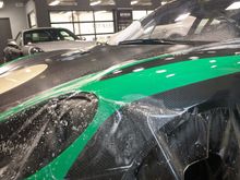 Applying XPEL paint protection film on all panels.