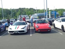 A 2015 Ferrari 458 Speciale and my 911SC at C&C two weeks ago.  The F458 is three years old and has 1000 miles on it. Beautiful car owned by a nice guy who has a water cooled P-car, too. My 82 SC has almost 220 times the mileage and is still good looking to me.
