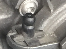 Do I unscrew the 4 bolts, and what is this lil black knob?