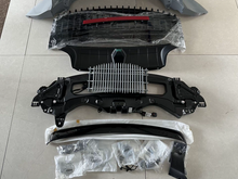 There are a lot of things in the OEM kit with a hood plate and a tail bracket.