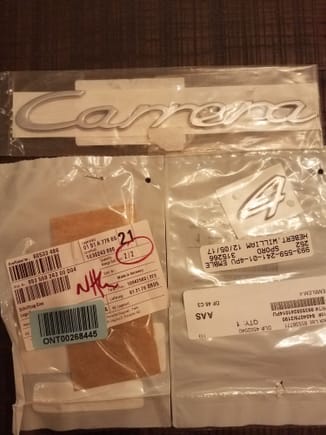 Although you cant clearly make out what these are, these are the Porsche factory emblems/script to apply to the stock decklid. Carrera, 4 and S are here. The decklid is an unused original factory decklid that has been boxed since 1998 from a C2S. 