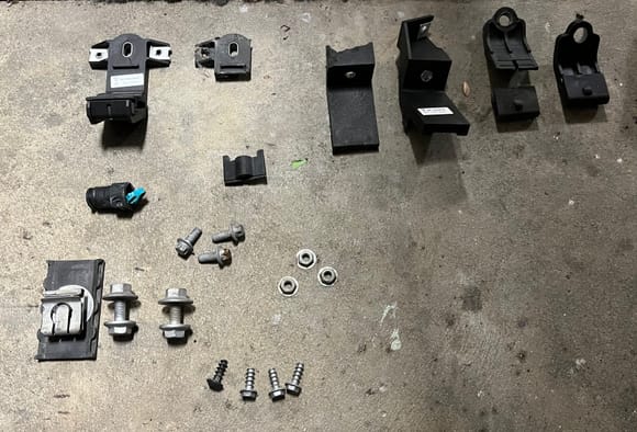 Broken parts being lined up with new ones. 
