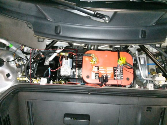 Black box on the far left is the control box. Remote mount compressor is next to the Optima battery. Changing to the smaller Optima was done to make space for the compressor mount. All the OEM trim panels fit and the frunk looks stock. 