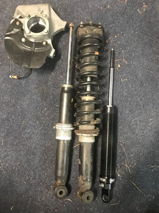 Factory rear late model shock left early shock middle and longer body MCS on the right. I believe they can mix and match for youa s well but then you have to consider spring rates and lengths.