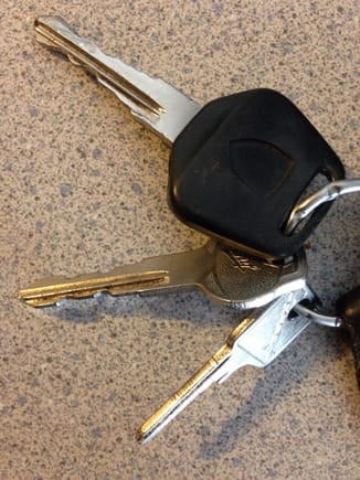 Top: Ignition/doors/hatch/glove box/ gas door key, 
Middle: security key for cars with alarm,
Bottom: wheel lock key.