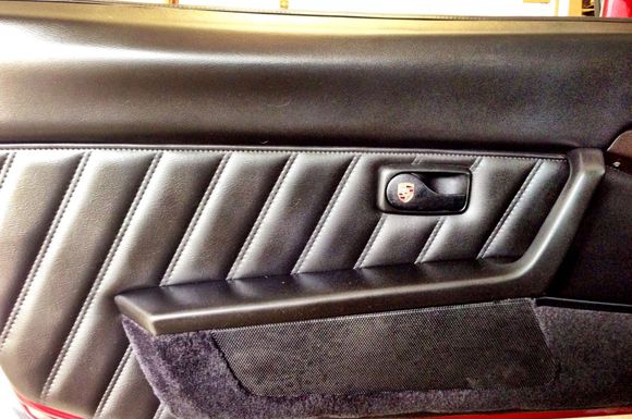 With new Porsche crested handles.  They were originally blue but have been died black.  Color match is perfect to my eyes.